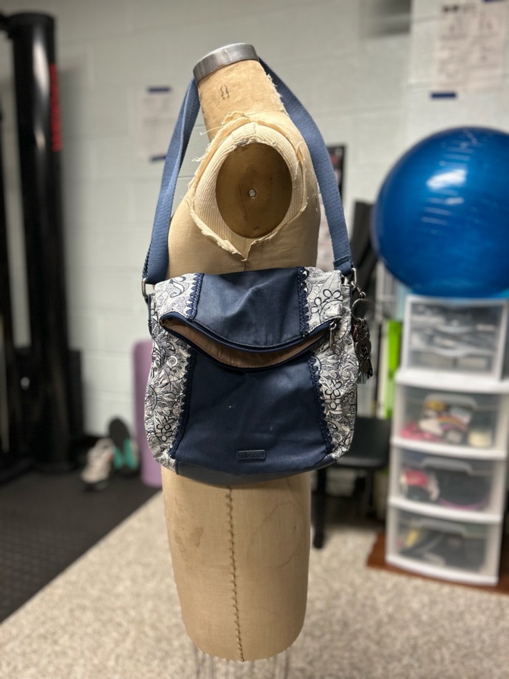 Sakroots Navy Crossbody with Floral Side Panels and Blue Strap